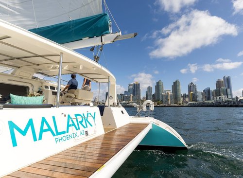 Malarky catamaran cruising near the San Diego skyline