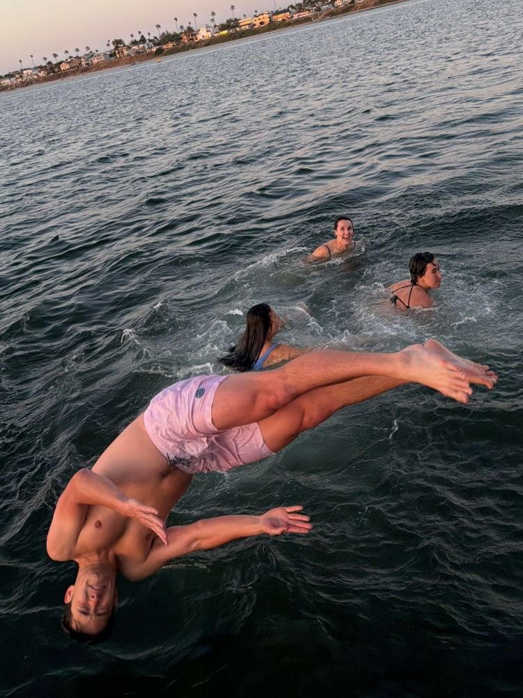 Sideways dive into Mission Bay during a group outing